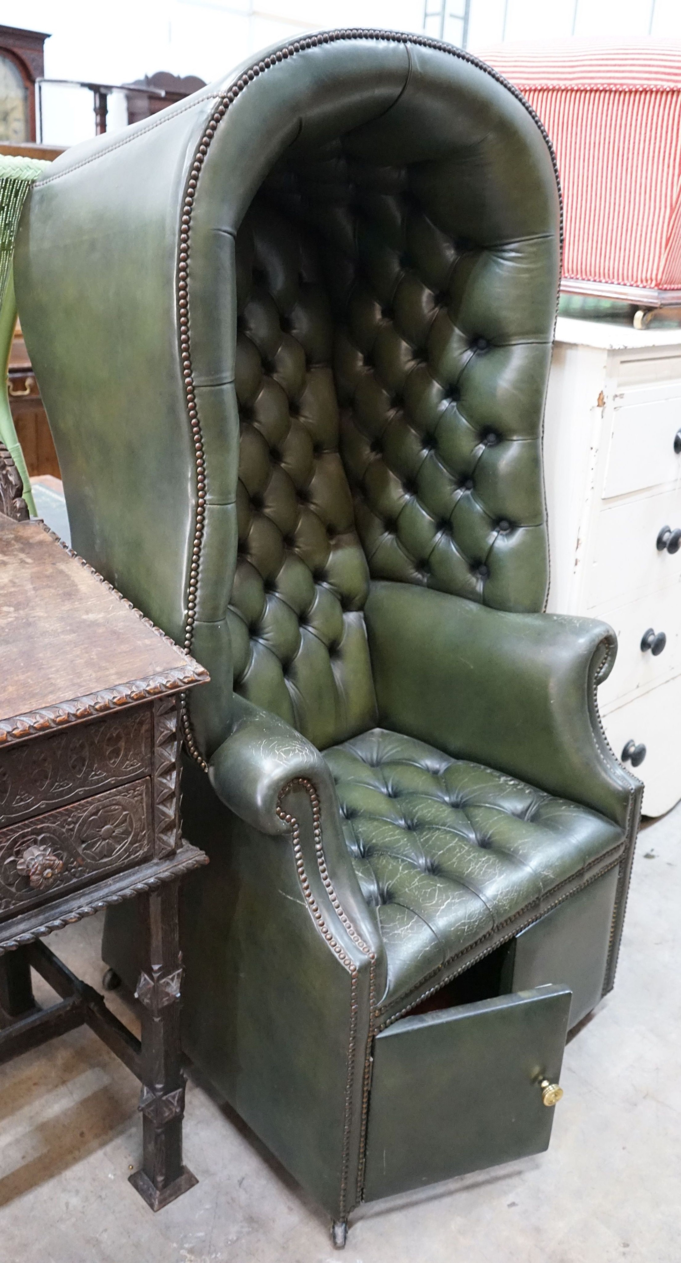 A reproduction buttoned green leather porter's chair, width 82cm, depth 66cm, height 160cm